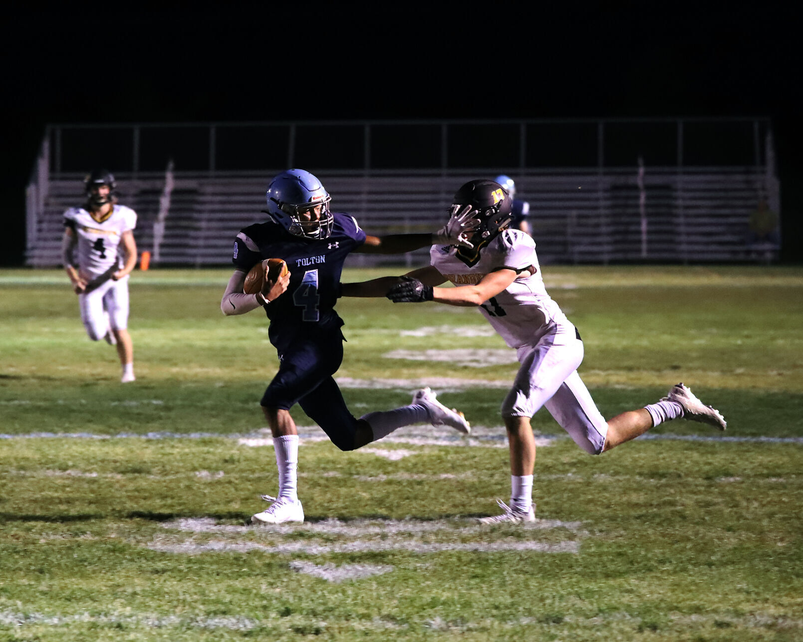 Tolton’s senior Trace Reddick holds off Grandview’s